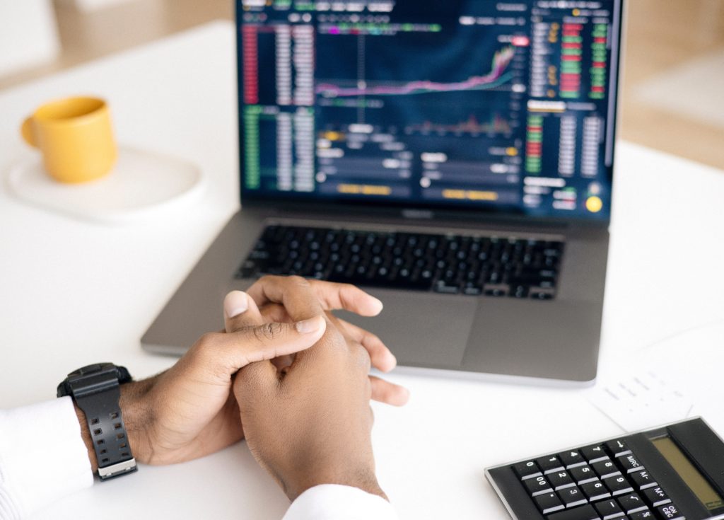 A Man is Checking His Stock Trading With Python